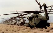 Image: CH-53 Sea Stallions are parked in a line at the landing zone near Yuma, Ariz.