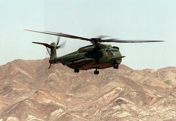 Image: A CH-53 Sea Stallion makes a final approach for landing on the desert floor.