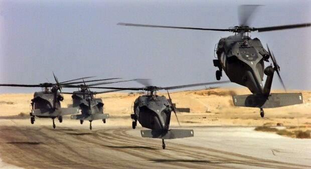 Image: U.S. Army UH-60L Black Hawk helicopters lift off at Cairo West Air Base